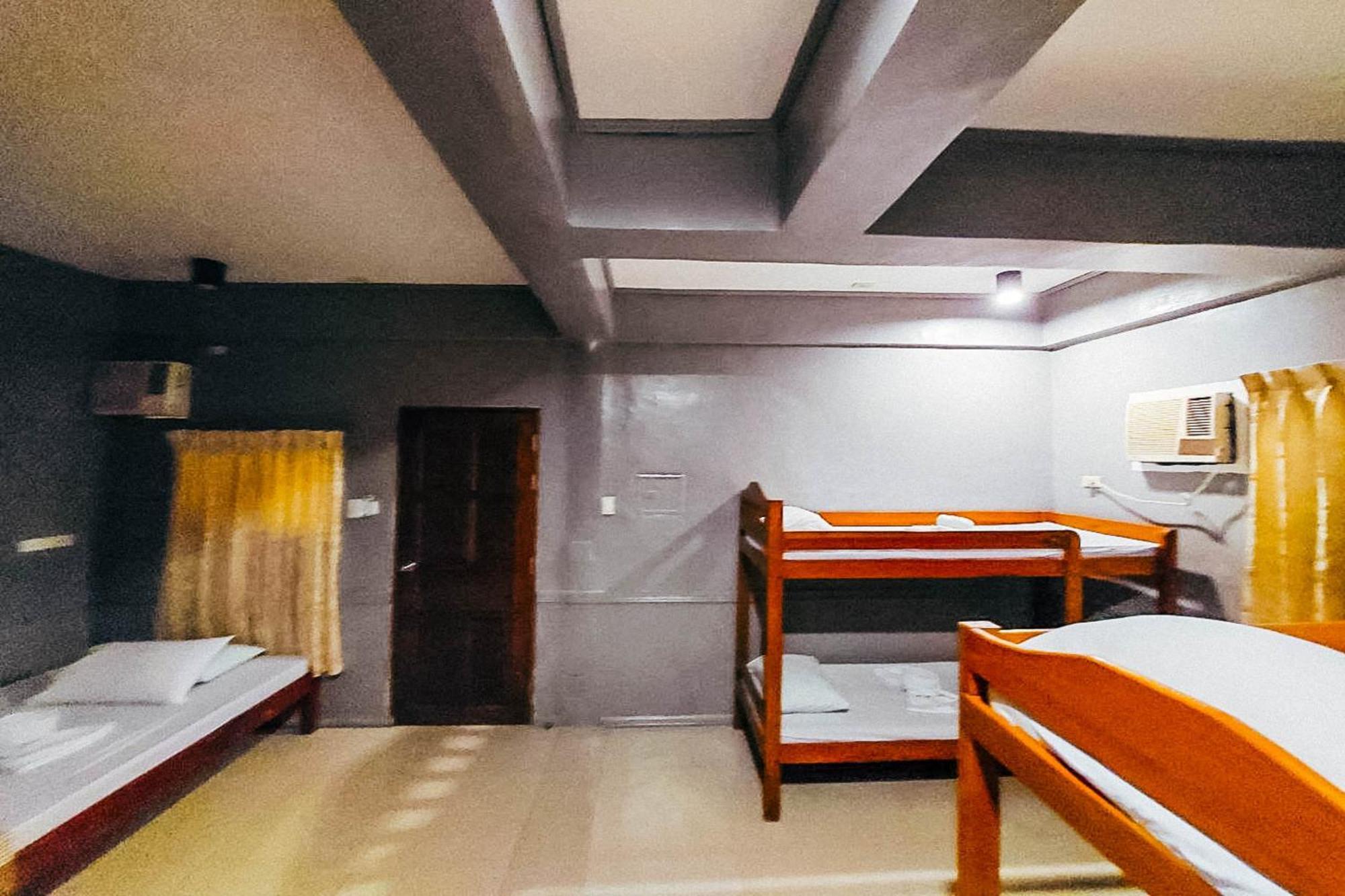 Mbg Travellers Inn Powered By Cocotel Puerto Princesa Zimmer foto