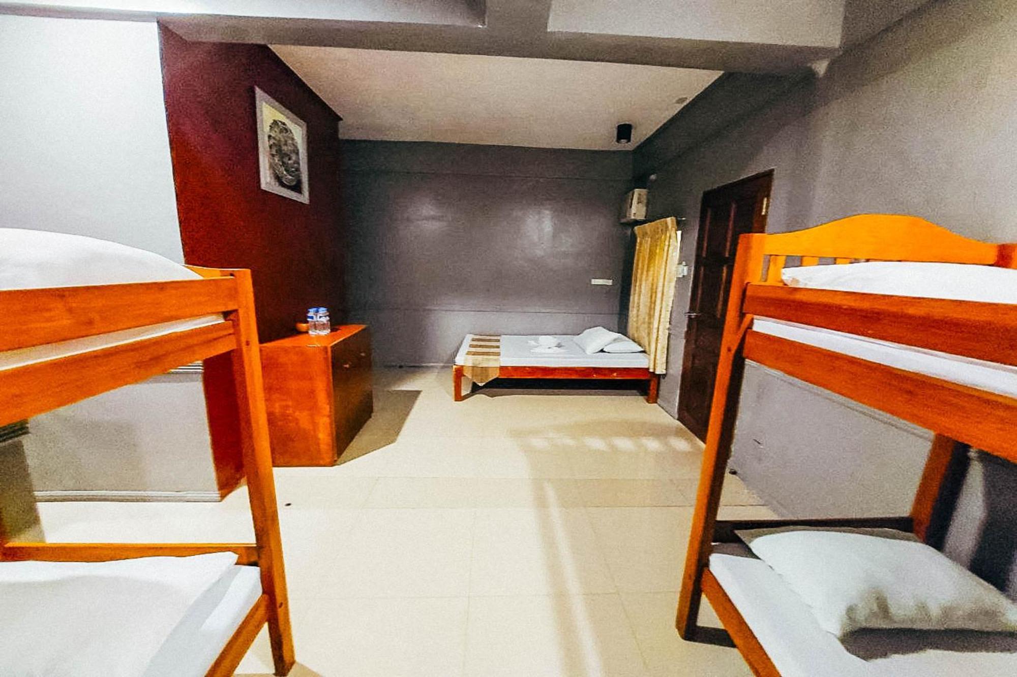 Mbg Travellers Inn Powered By Cocotel Puerto Princesa Zimmer foto