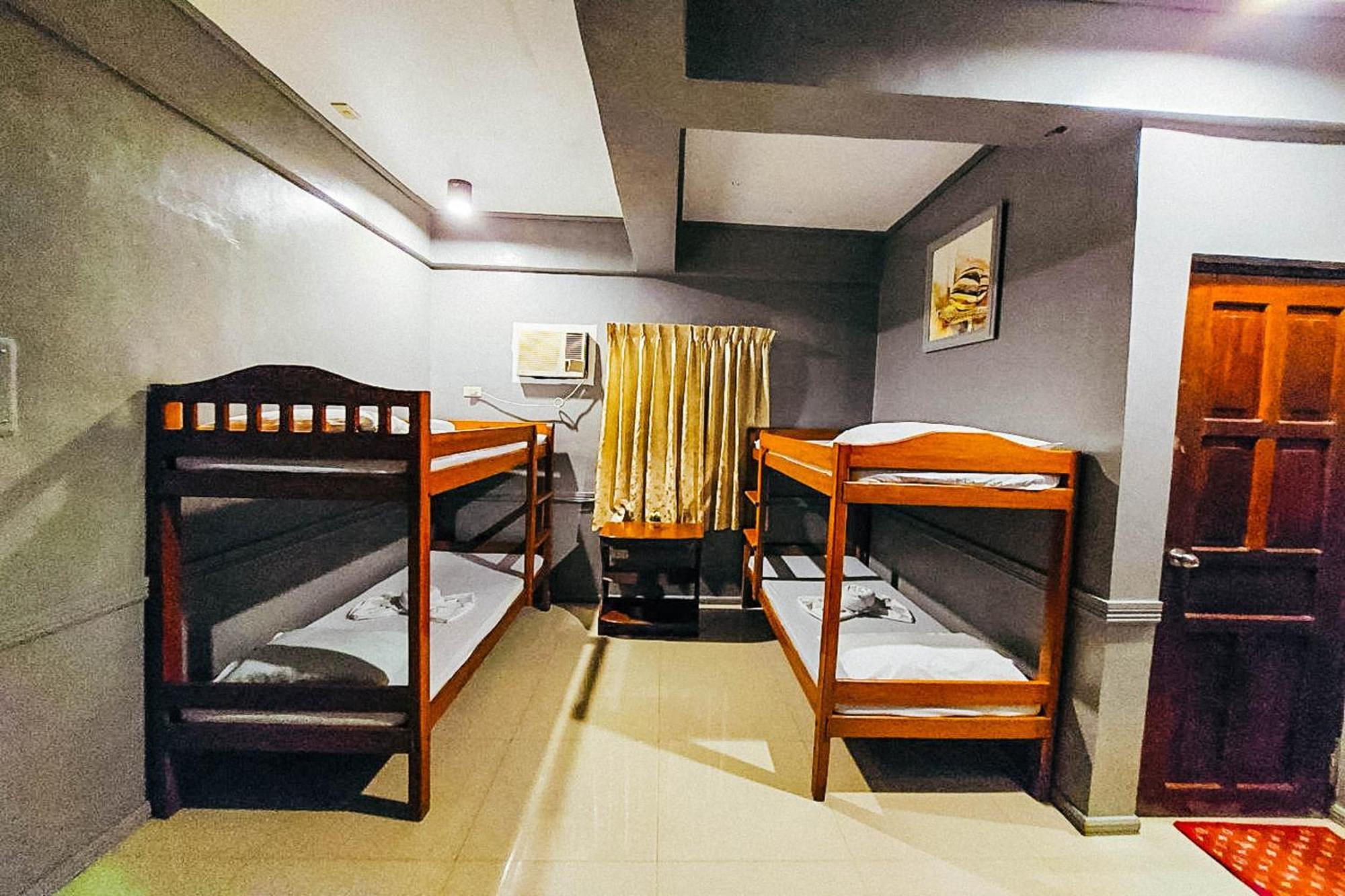 Mbg Travellers Inn Powered By Cocotel Puerto Princesa Zimmer foto