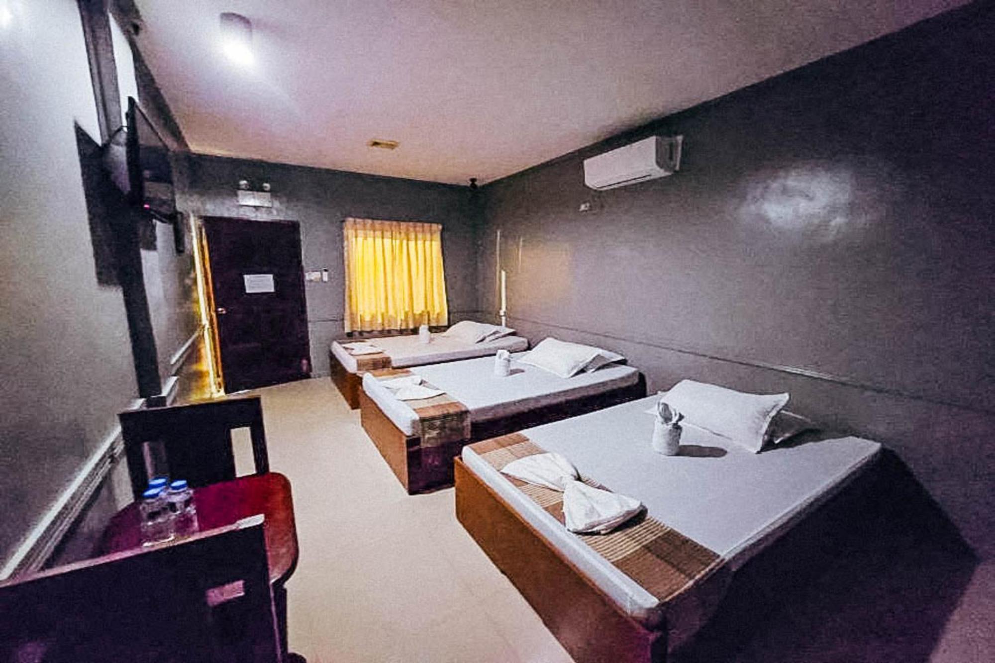 Mbg Travellers Inn Powered By Cocotel Puerto Princesa Zimmer foto