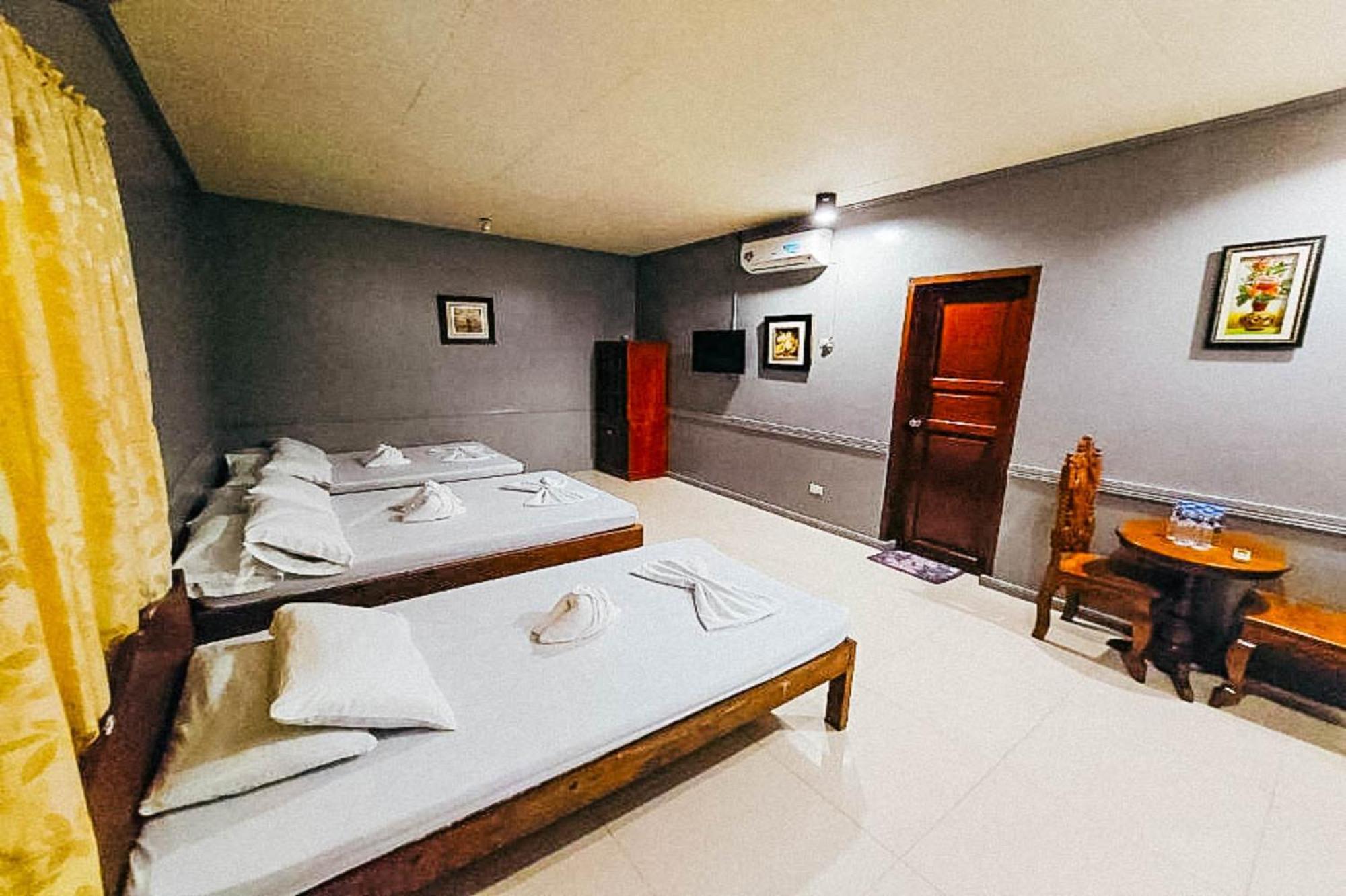 Mbg Travellers Inn Powered By Cocotel Puerto Princesa Zimmer foto