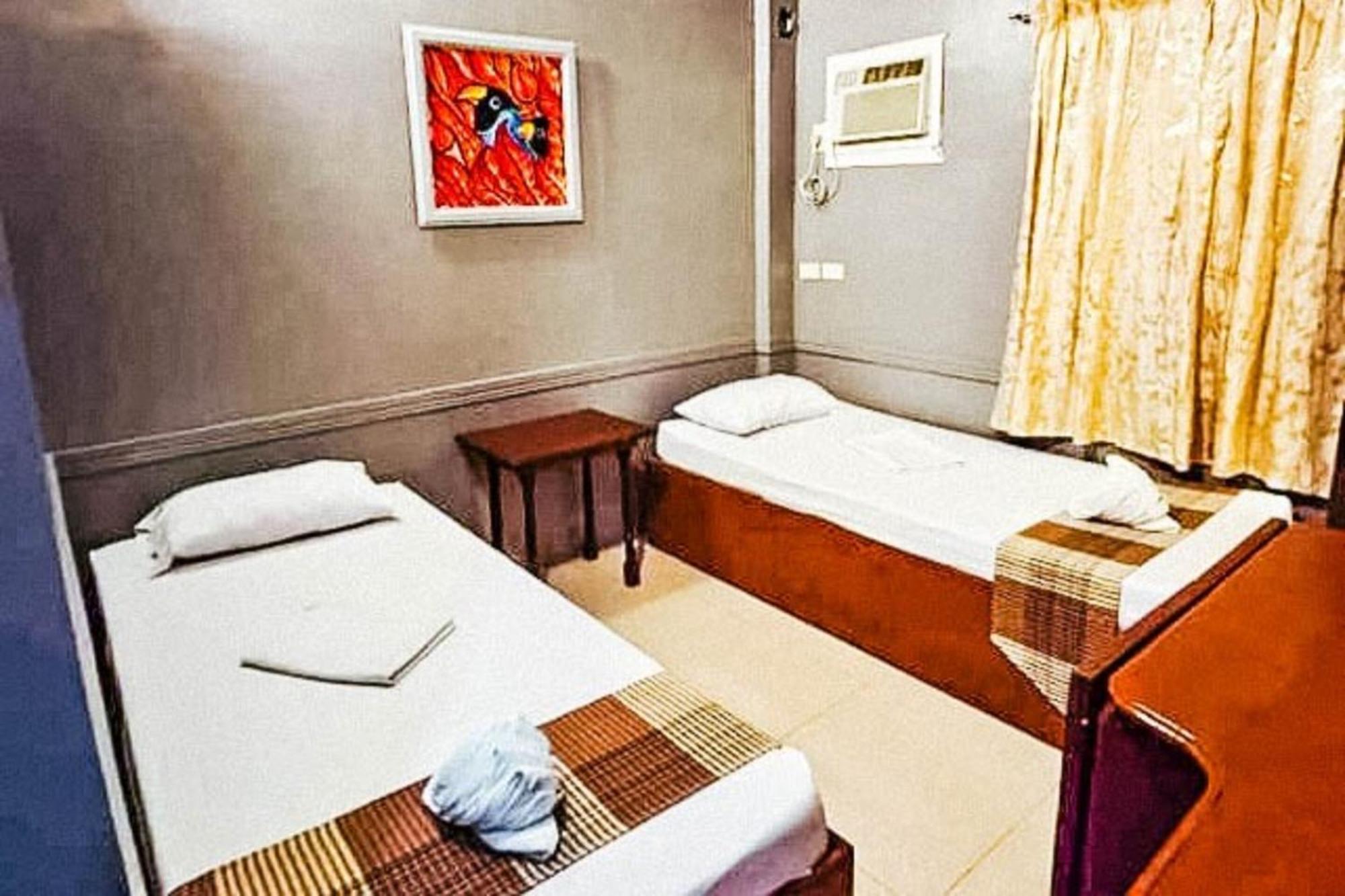 Mbg Travellers Inn Powered By Cocotel Puerto Princesa Zimmer foto