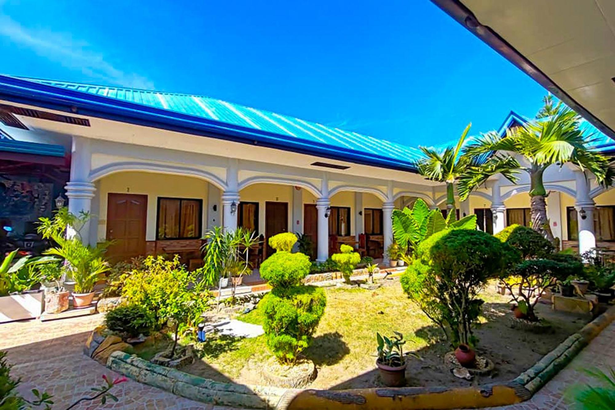 Mbg Travellers Inn Powered By Cocotel Puerto Princesa Exterior foto